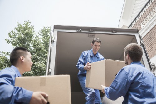 Unloading furniture and boxes at a new home in Northend